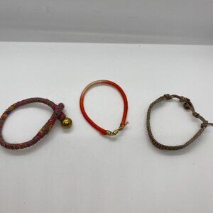 Lot of three gold tone hardware bracelets